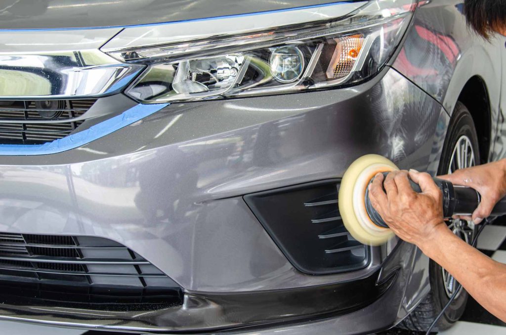 male holding car polishing machine paint correction Lucent ReflectionZ Oak Lawn IL